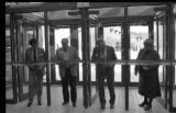 People cutting a ribbon at the dedication of the Physical Education Building addition