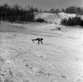 A person falling while skiing on Rock Hill