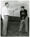 Coach Lester Bolstad instructing Golf Team Member in Memorial Stadium