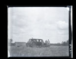 Thomas Roberts, William Kilgore, and Walter Breckenridge standing next to car and closed trailer
