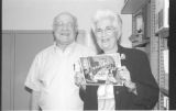 Oren and Sharron Steinfeldt holding a photo at the JHSUM dedication of the Kaplan Family History Center at the Sabes JCC. Minneapolis, Minnesota.