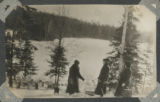 Group of three people standing by Mary Lake
