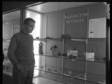 A person looking at a "Radioactive Minerals" display in the addition of the Science Building at UMD