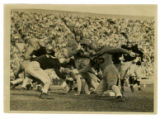 Football Game, Iowa versus Minnesota with Mark Heffelfinger carrying the ball and Bill Elliott (#25)