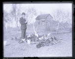 H.J. Jaeger of Owatonna in the midst of his chickens, ducks, and geese