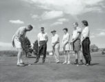 Golfers on course at free golf event UMD 1959