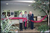 People cutting the ribbon for the opening ceremony of the School of Business and Economics at UMD