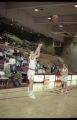 Action shot of UMD 1997 women's basketball player #44 shooting the ball during a game