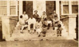 Family on the steps of a house