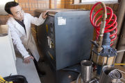 Dr. Yun Li and Dr. Roger Ruan with equipment used to analyze food products.