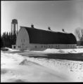 Exterior of barn with watertower at the Northeast Experiment Station in winter