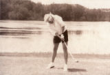 Person playing golf on a University of Minnesota Duluth men's hockey golf outing