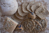 Milling wheat at a small bakery in Maplewood,Minnesota, where breads, muffins, rolls and cookies are baked using Whole grains.