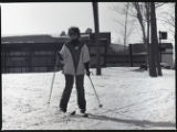Action shot of UMD 1979 women's downhill skier on the slopes