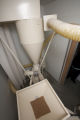 Milling wheat at a small bakery in Maplewood,Minnesota, where breads, muffins, rolls and cookies are baked using Whole grains.