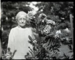 Mrs. Crosby in her garden with Dahlias