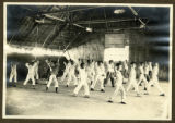 Nanking YMCA Physical Department: A class in the mat shed gym. This gym is 50' x 85', built of bamboos and grass matting. It c