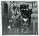 Family posing on a doorstep