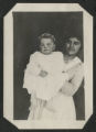 Chester Adgate Congdon II as a baby being held up by an unidentified adult