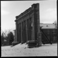 Side view of the Old Main building archway with building in background