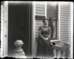 Mrs. Roberts on the porch in front of Dr. Roberts's office