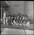 UMD 1974 women's field hockey team in front of the physical education building