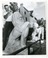 Repainting lions at the Sigma Alpha Epsilon fraternity house, Minneapolis, Minnesota