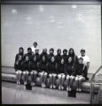 UMD 1970 women's swim squad in front of the pool