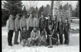 UMD 1981 women's ski squad posed in front of "Welcome to the University of Minnesota" sign