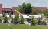 Robert W. Bridges Fleet Grounds Maintenance Building with work trailers and cranes