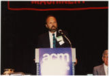 Man Giving Presentation at ACM Annual Meeting (Box 4, Folder 7)