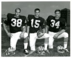 Football Team Members Barry Mayer (#38), Phil Hagen (#15), Jim Carter (#34)