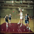 Action shot of UMD 1998 women's basketball player #54 shooting the ball during a game