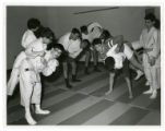 Jeanne Haggett teaches a judo class to children in the exercise room at the St. Paul Jewish Community Center