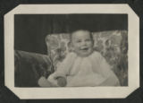 Chester Adgate Congdon II as a baby sitting in a chair