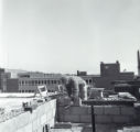 Bricklayer mortars cinder blocks on top of the Education and Psychology Building