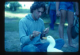 Camp Butwin staff member feeds a goose, Eagan, Minnesota
