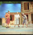 Three actors performing on stage in the 1998 UMD production of "The Betrothed"