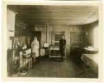 Kitchen of the Y hut in Minsk, Russia, where the YMCA secretary L. L. Dunnington and his corps of workers at their meal one day, prepared by their Polish cook.