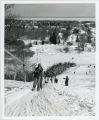 Students downhill skiing and using tow line at Rock Hill