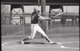 Action shot of UMD 1986 women's softball player at bat