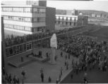 A crowd watching the uncovering the Sieur du Lhut statue