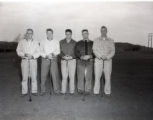UMD 1963 men's golf team posed with clubs on golf course