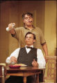 Two actors performing on stage in the 2001 UMD production of "Odd Couple"