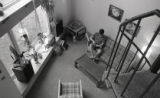 Student reading a book in the Stadium Apartments