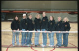 UMD 2001 women's tennis team posed behind net