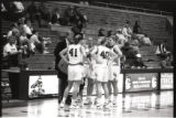 UMD 1997 women's basketball players huddled on the court during a game