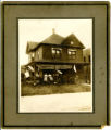 Family of Sam Cohen sits on the porch of their home in Virginia, Minnesota