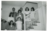 Suzon Karon, Robert J. Karon, Janet Karon, and others standing on interior stairs