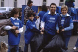 Members of the Mount Sinai Hospital and Phillips neighborhood clean-up crew hold trash bags, Minneapolis, Minnesota